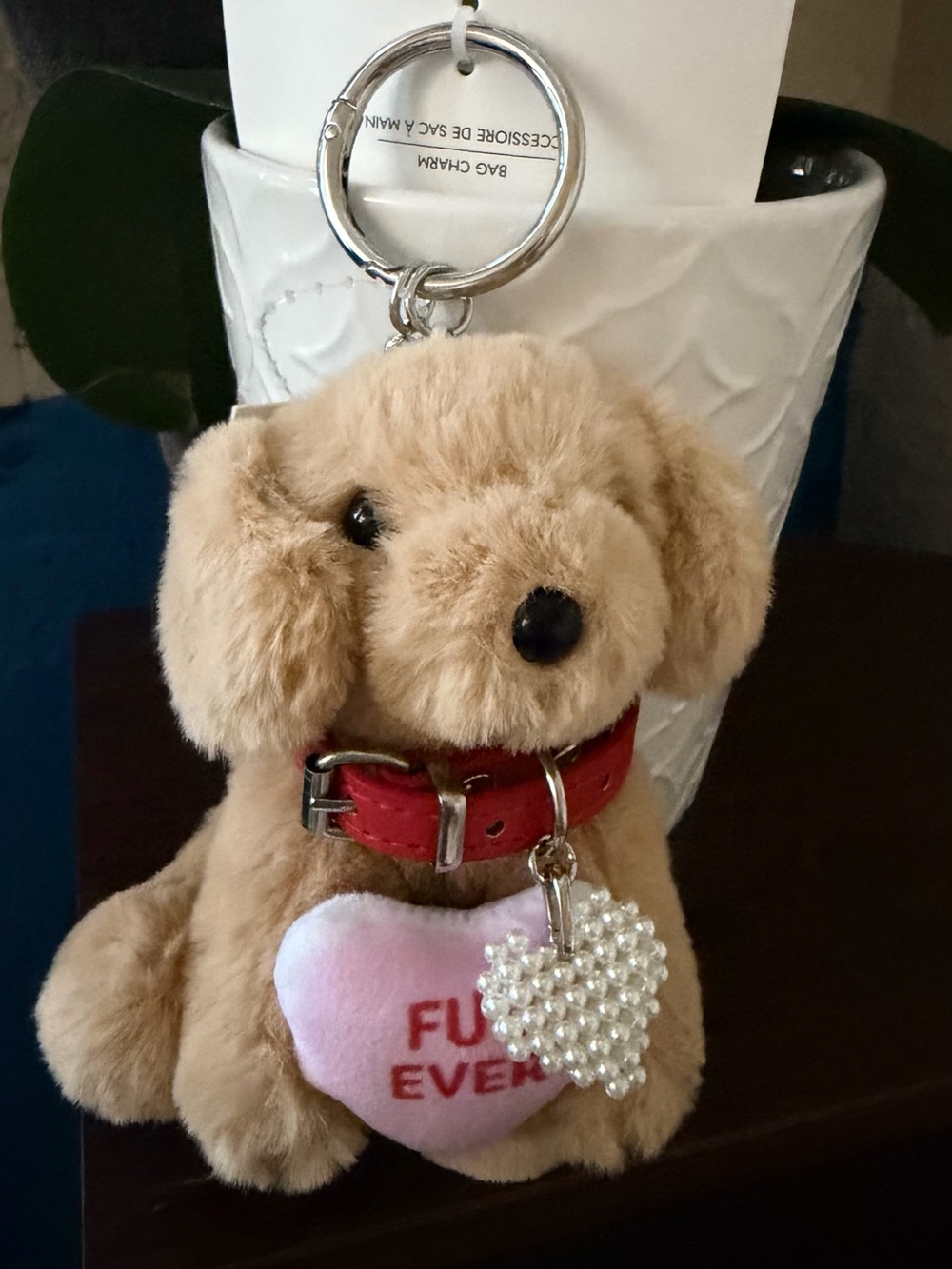 Aldo Beige Plush Dog Keychain with Red Collar and Pink Heart Charm